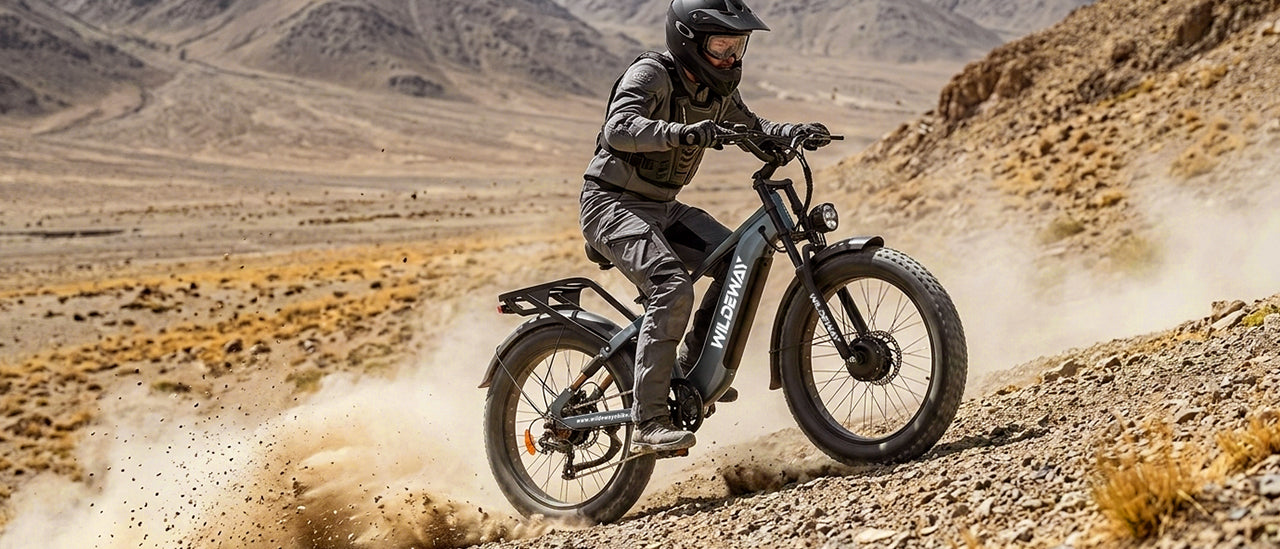 A rider confidently controlling the Wildeway Soared e-bike on a downhill trail, showcasing its dual hydraulic brakes and dual crown fork for superior safety and stability.