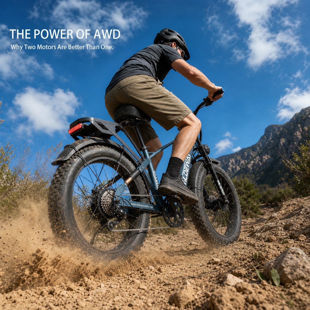 Low angle shot of a WILDEWAY SOARED AWD e-bike tearing through mud, showing both front and rear hub motors.